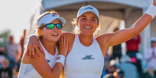 Anna Leigh Waters and Catherine Parenteau celebrate on the pickleball court.