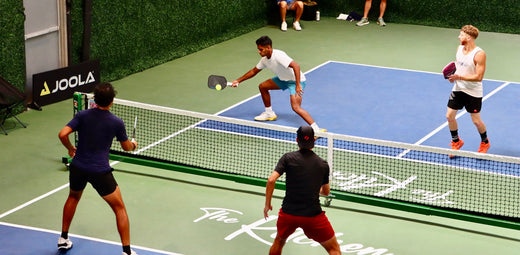 Dinking being done during a pickleball tournament