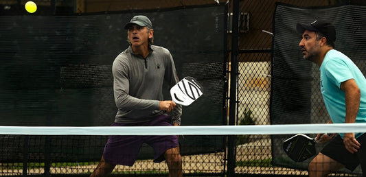 A pickleball player gets ready to hit a shot.