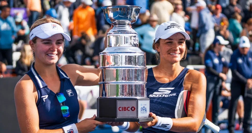 Anna Leigh Waters, left, and Catherine Parenteau, right, celebrate with their trophy at the PPA Tour's 2024 CIBC Finals event.